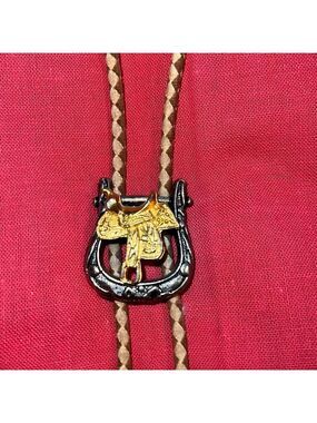 Bolo tie, western motif with saddle.